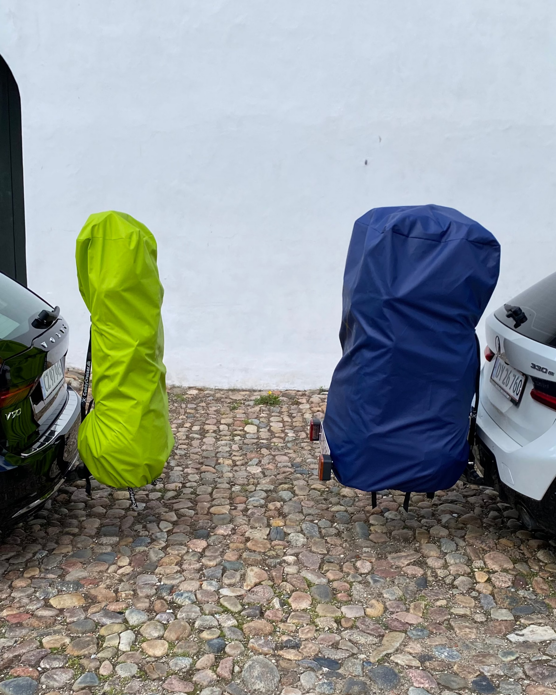 Lime green raincover for 2 bags and royal blue raincover for 4 bags